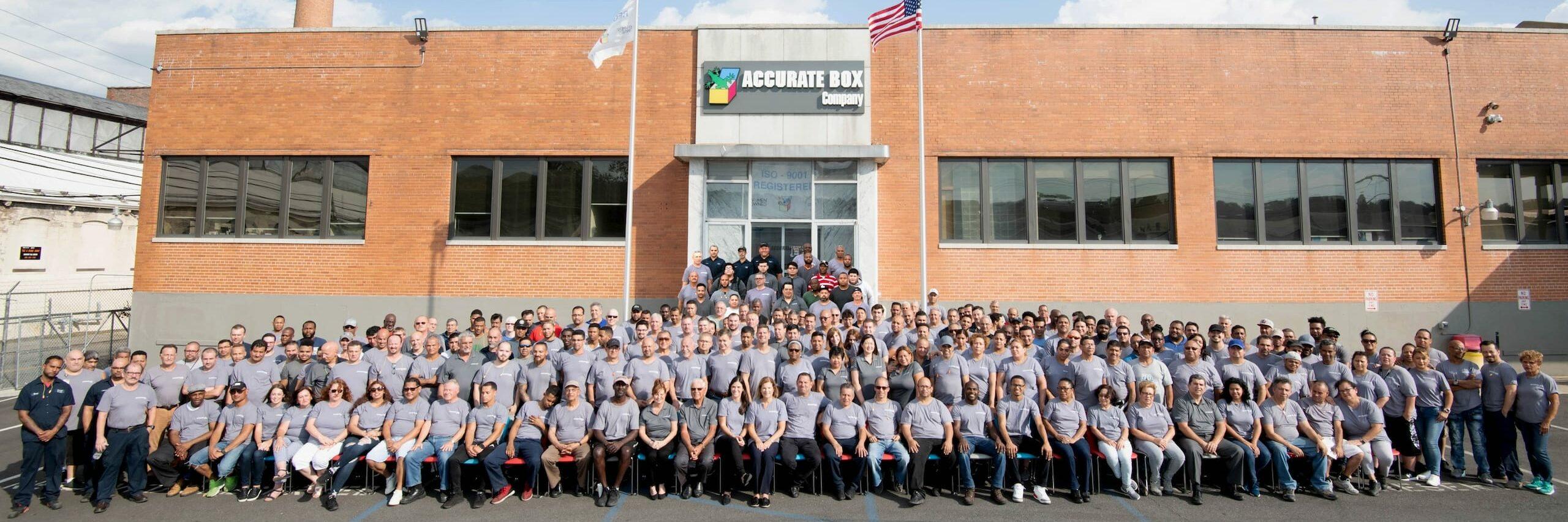 Accurate Box Company team photo in font to their office.