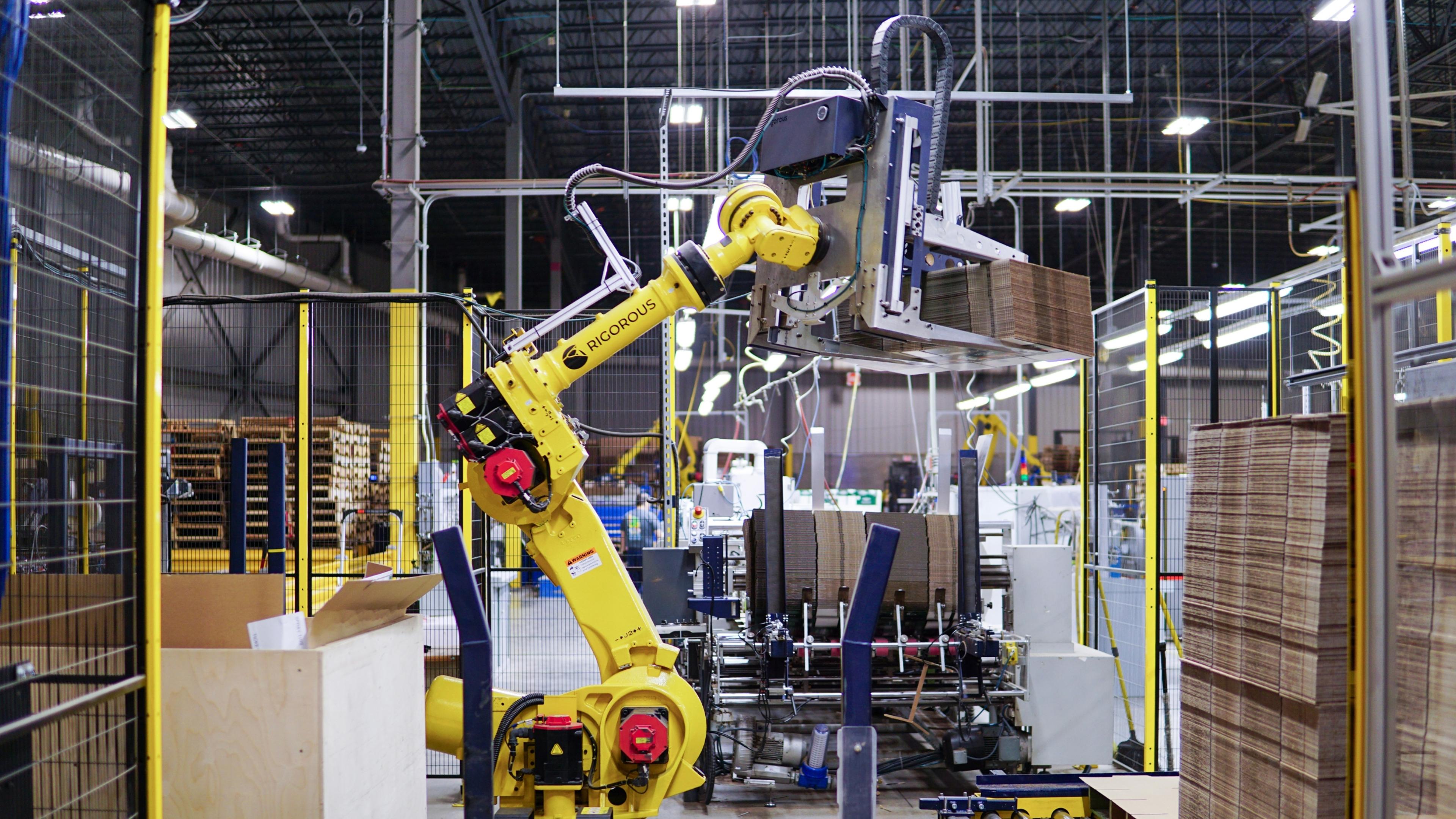 Material Handling robot feeding a high-speed machine.